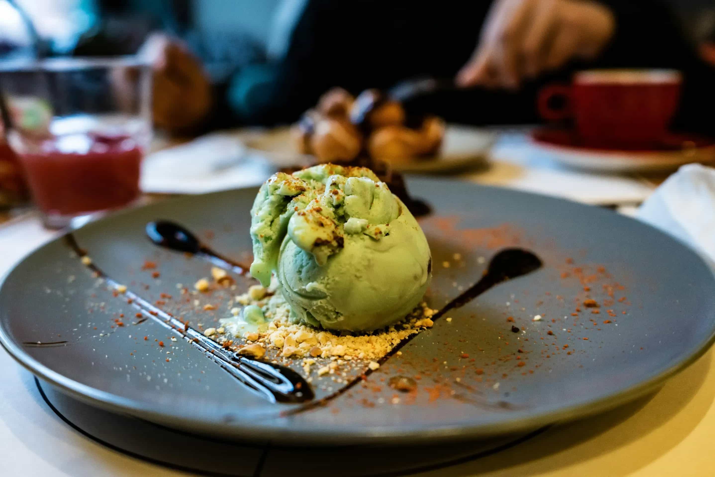 Ice cream on a plate in a restaurant. vertically mirrored