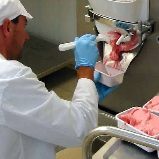 Farmer working at an ice machine.